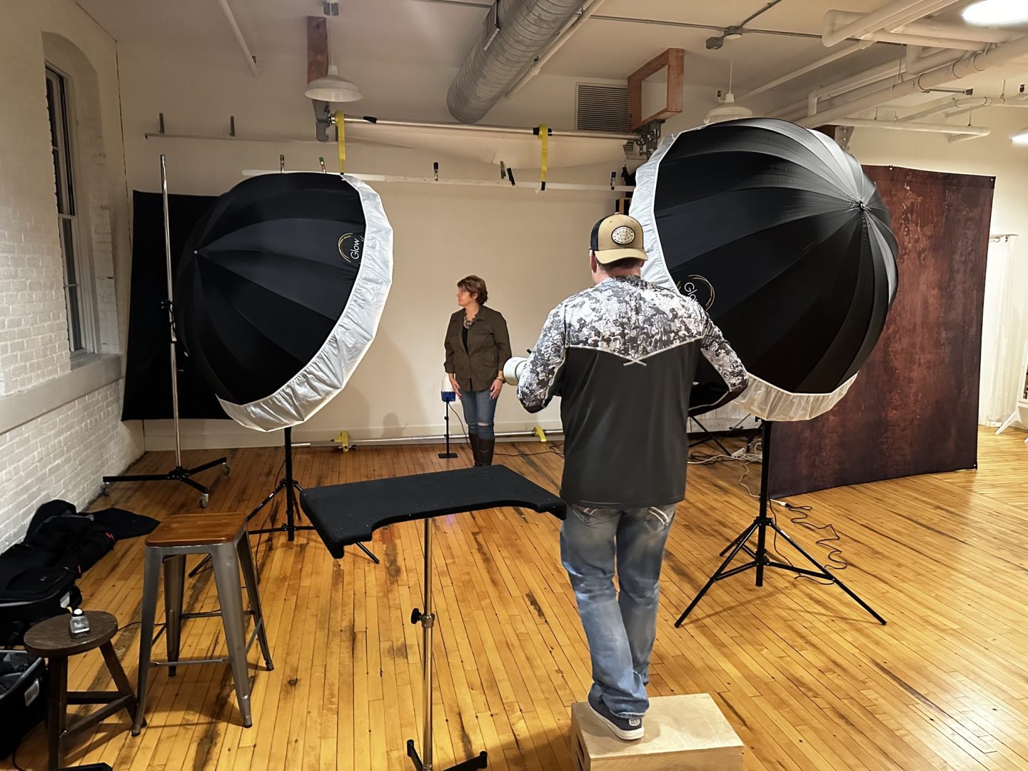 jbx owner capturing clent photography headshot in studio
